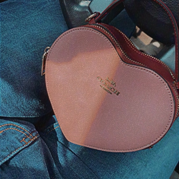 I am selling my coach bag. It is pink and red. Its a great Valentine’s Day gift. - Picture 2 of 4